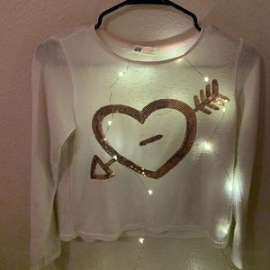 A White Shirt With A Heart On It